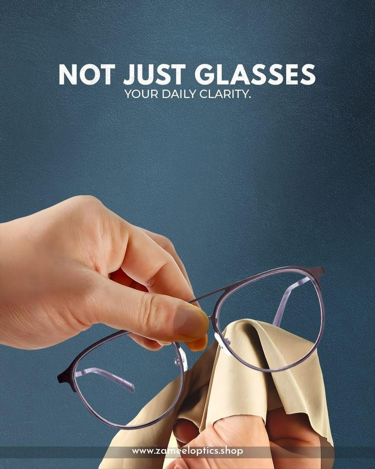 Hand holding stylish eyewear above fabric, promoting the Future of Eyewear at Zameel Optical.