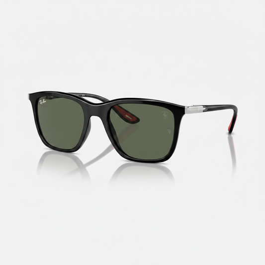 Ray-Ban Wayfarer-style sunglasses with a black acetate frame, green-tinted lenses, and silver metal temples with red accents, shown on a light gray background with a soft reflection.